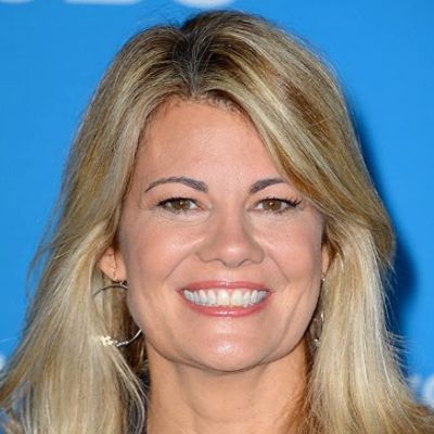 Lisa is smiling and getting her pictures clicked.